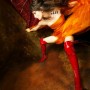 istockphoto_1863179-young-woman-posing-wrapped-in-orange-silk-fabric